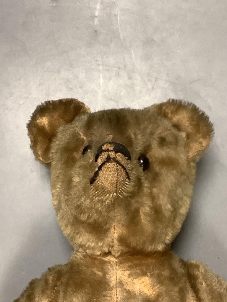 A vintage teddy bear DAN TO REPORT